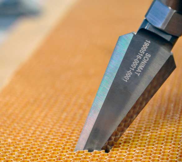 Ultrasonic blade honeycomb core cutting